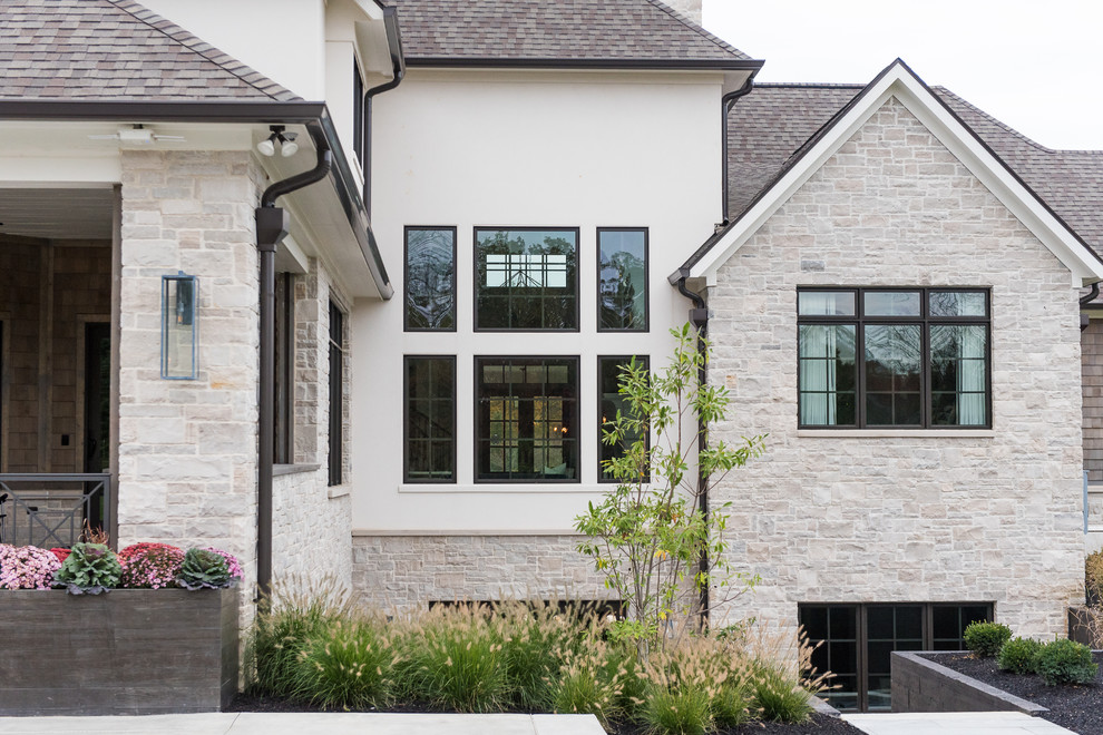 Inspiration for a large transitional white two-story mixed siding gable roof remodel in Indianapolis with a shingle roof