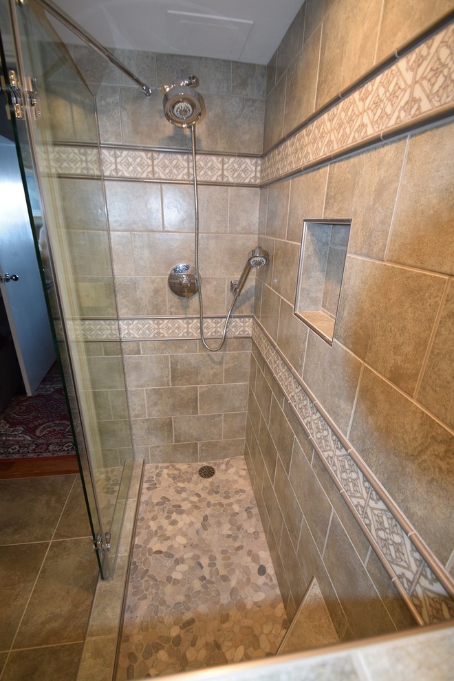 Example of a small transitional master multicolored tile and ceramic tile ceramic tile doorless shower design with raised-panel cabinets, white cabinets, a two-piece toilet, gray walls, a vessel sink and quartz countertops