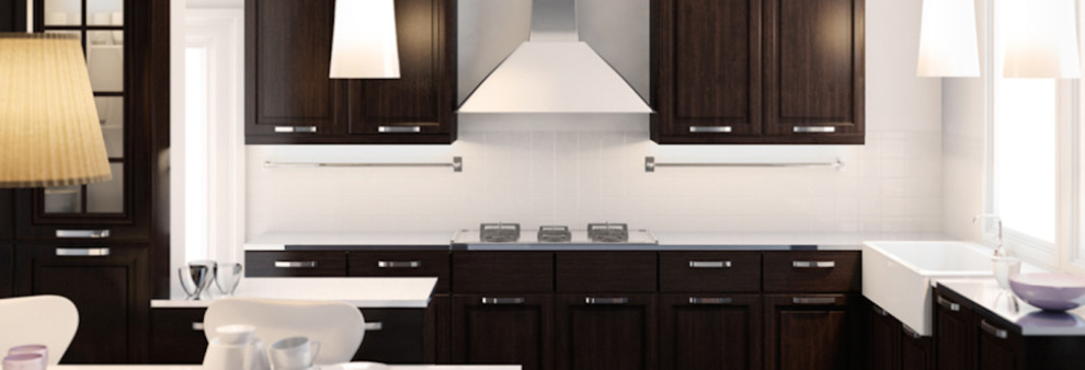 U-shaped eat-in kitchen photo in Ottawa with an integrated sink, raised-panel cabinets, dark wood cabinets, soapstone countertops, white backsplash, mosaic tile backsplash, stainless steel appliances and an island