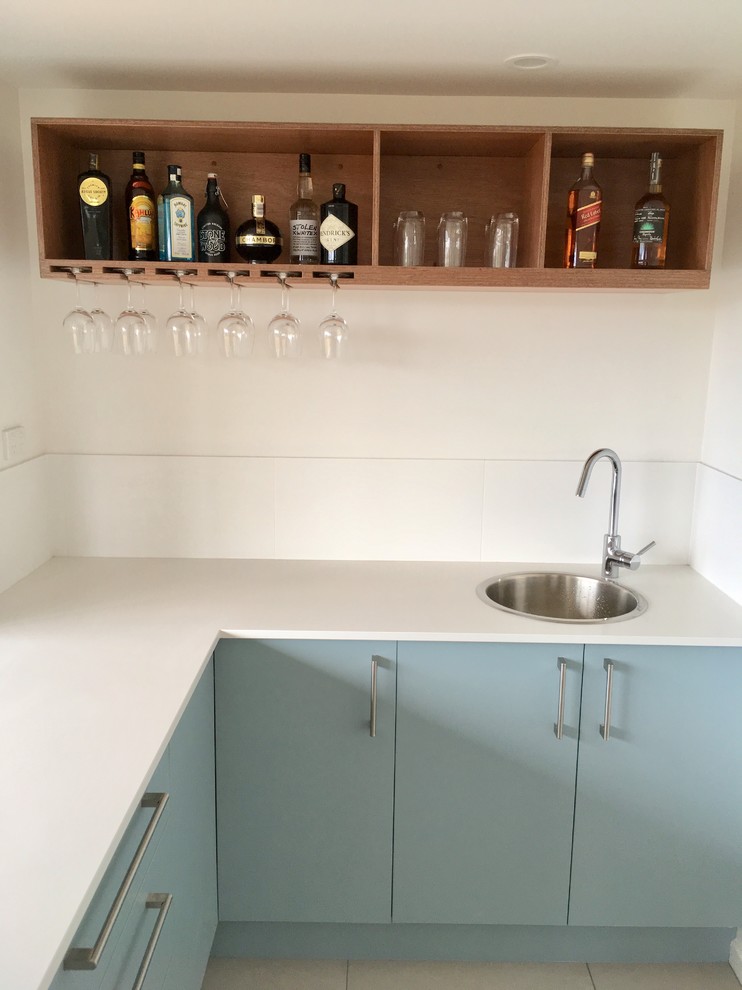 Design ideas for a mid-sized contemporary home bar in Sunshine Coast with medium wood cabinets.