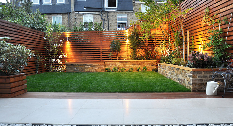 This is an example of a modern backyard formal garden in London.