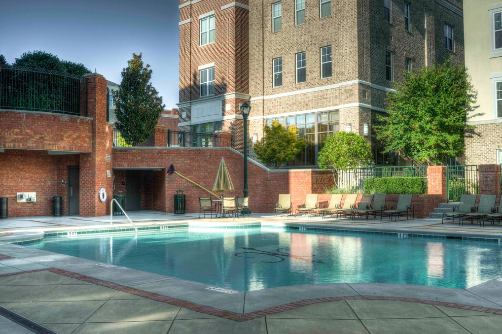Inspiration for a mid-sized courtyard stamped concrete and rectangular lap pool house remodel