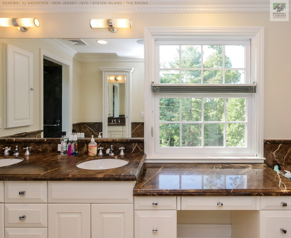 Inspiration for a large master bathroom in Newark with white cabinets, a hot tub, a shower/bathtub combo, a two-piece toilet, brown tile, marble, beige walls, an undermount sink, marble benchtops, an open shower, brown benchtops, an enclosed toilet, a double vanity and a built-in vanity.