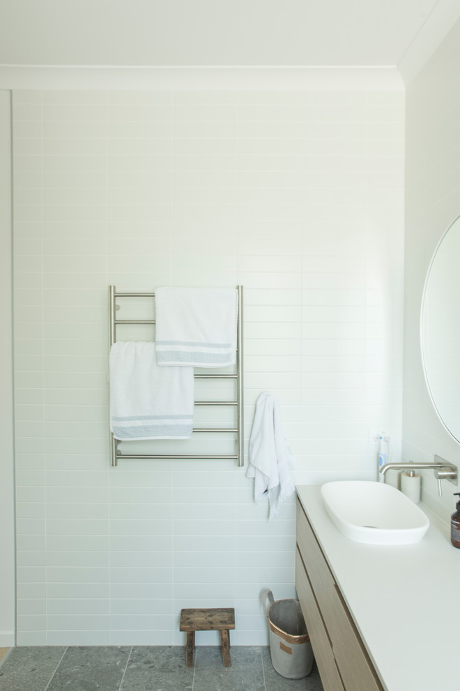 Design ideas for a mid-sized contemporary master bathroom in Sunshine Coast with flat-panel cabinets, light wood cabinets, an open shower, ceramic tile, ceramic floors, engineered quartz benchtops, grey floor and white benchtops.
