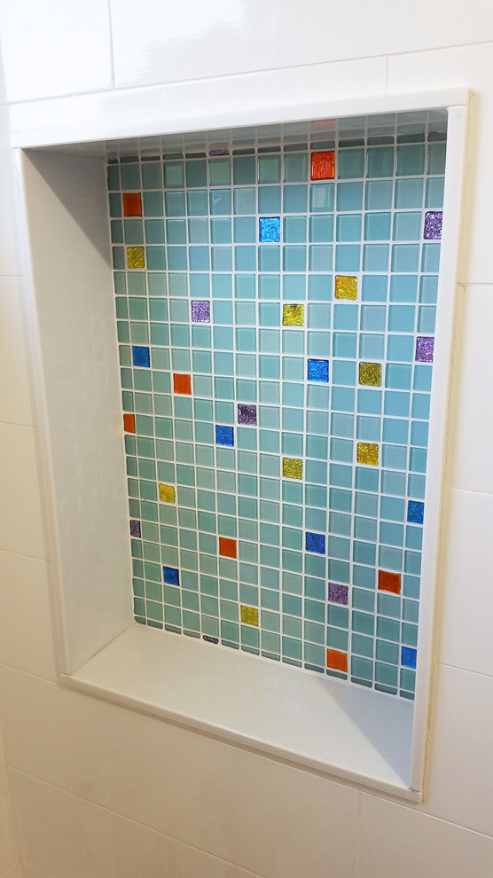 Design ideas for a small eclectic bathroom in New York with multi-coloured tile and glass tile.