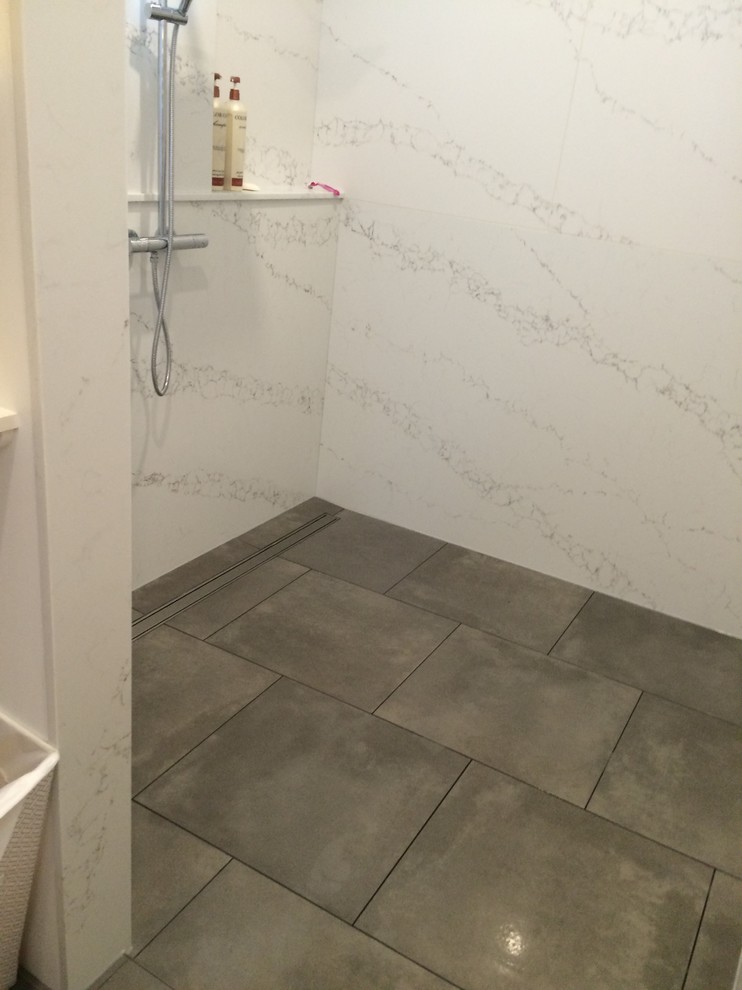 Freestanding bathtub - mid-sized contemporary master white tile and porcelain tile vinyl floor and multicolored floor freestanding bathtub idea in Edmonton with flat-panel cabinets, light wood cabinets, a two-piece toilet, white walls, a drop-in sink and granite countertops