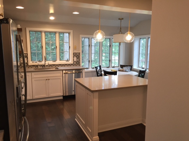 Statement Patterned-Tile Backsplash in a Contemporary, Neutral Kitchen