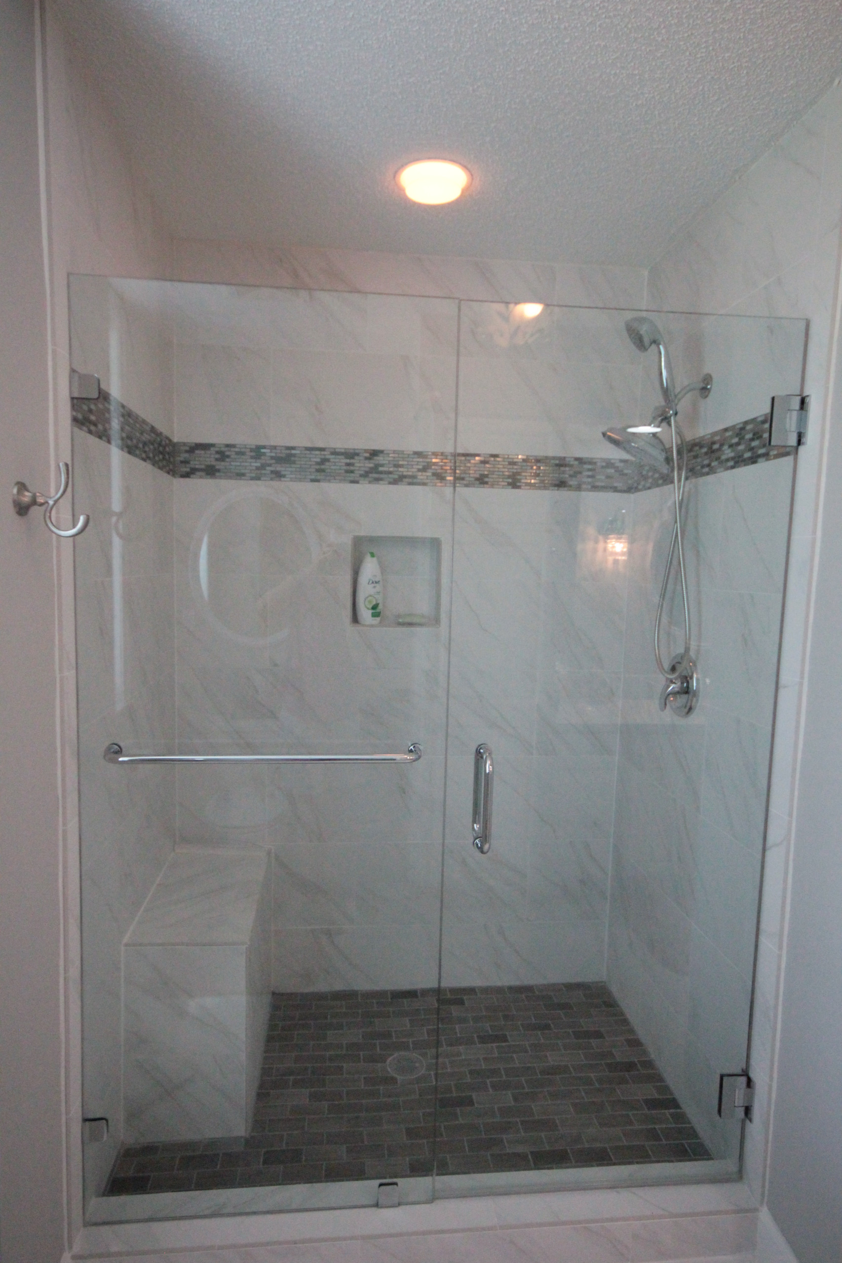 New shower with marble-look tile.