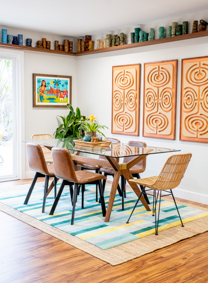 Inspiration for a midcentury open plan dining in Orange County with white walls, medium hardwood floors and brown floor.