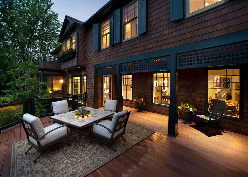 Photo of a mid-sized traditional backyard deck in New York with a fire feature and no cover.