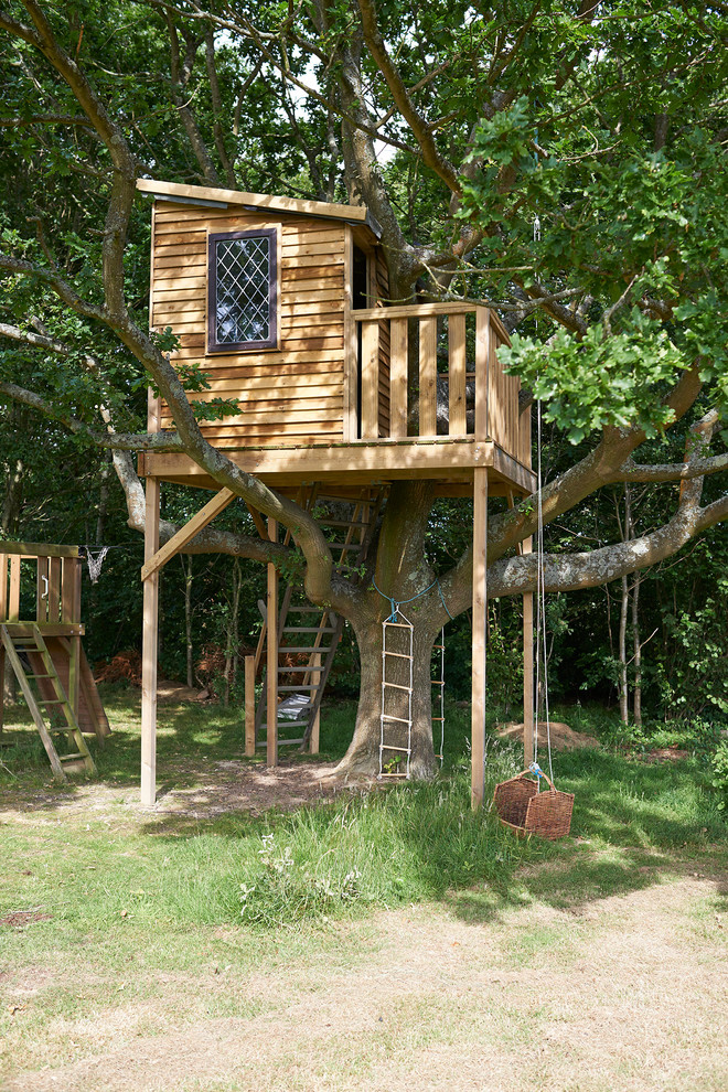 This is an example of a country garden in West Midlands with with outdoor playset.