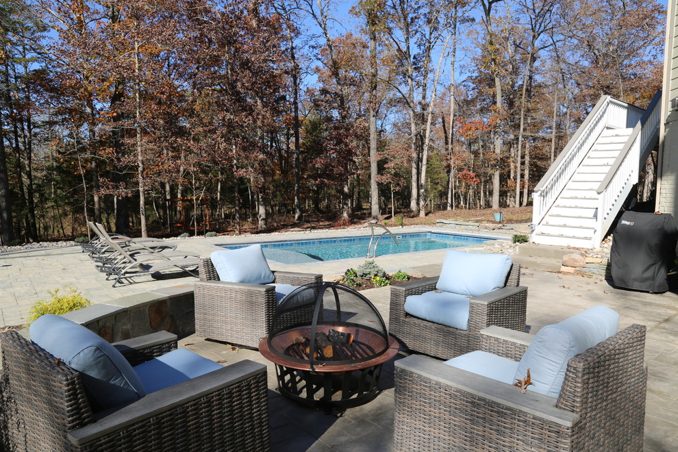 Pool - mid-sized rustic backyard concrete paver and rectangular pool idea in DC Metro