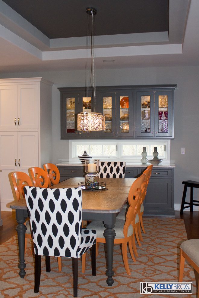 Design ideas for a large modern kitchen/dining combo in Cincinnati with medium hardwood floors.