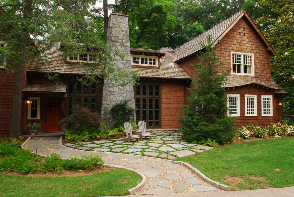 This is an example of a mid-sized country front yard full sun garden in Atlanta with natural stone pavers.