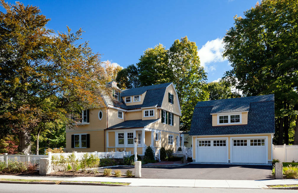 Photo of a small traditional detached two-car garage in Boston.