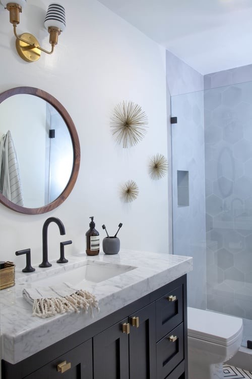 Design ideas for a mid-sized modern 3/4 bathroom in San Francisco with gray tile, cement tile, recessed-panel cabinets, dark wood cabinets, an alcove shower, a one-piece toilet, grey walls, concrete floors, a drop-in sink and marble benchtops.