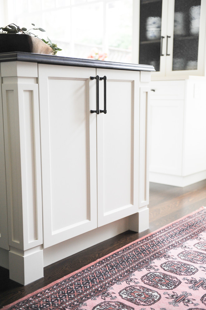 Enclosed kitchen - mid-sized transitional u-shaped dark wood floor enclosed kitchen idea in Vancouver with an undermount sink, recessed-panel cabinets, white cabinets, wood countertops, beige backsplash, terra-cotta backsplash, stainless steel appliances and an island