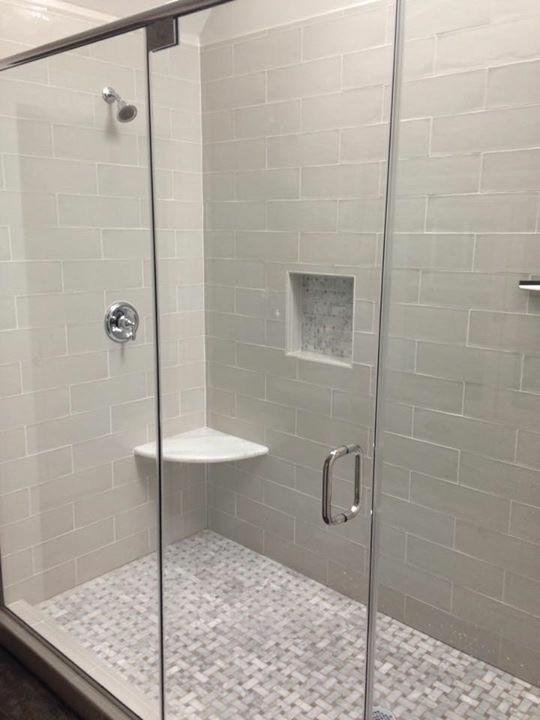 Inspiration for a mid-sized transitional master gray tile and porcelain tile double shower remodel with a hinged shower door
