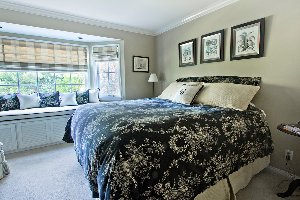 Inspiration for a large traditional master bedroom in Los Angeles with beige walls and carpet.