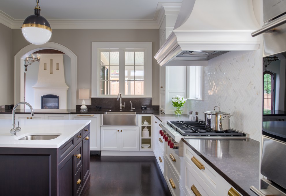 Large traditional u-shaped eat-in kitchen in DC Metro with a farmhouse sink, recessed-panel cabinets, grey cabinets, quartzite benchtops, white splashback, mosaic tile splashback, stainless steel appliances, dark hardwood floors and with island.