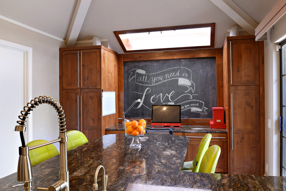 Eat-in kitchen - large transitional u-shaped travertine floor eat-in kitchen idea in Dallas with a farmhouse sink, medium tone wood cabinets, granite countertops, multicolored backsplash, matchstick tile backsplash, stainless steel appliances and a peninsula