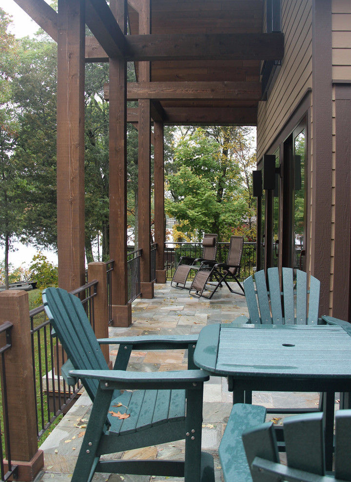 This is an example of a country deck in Milwaukee with a roof extension.