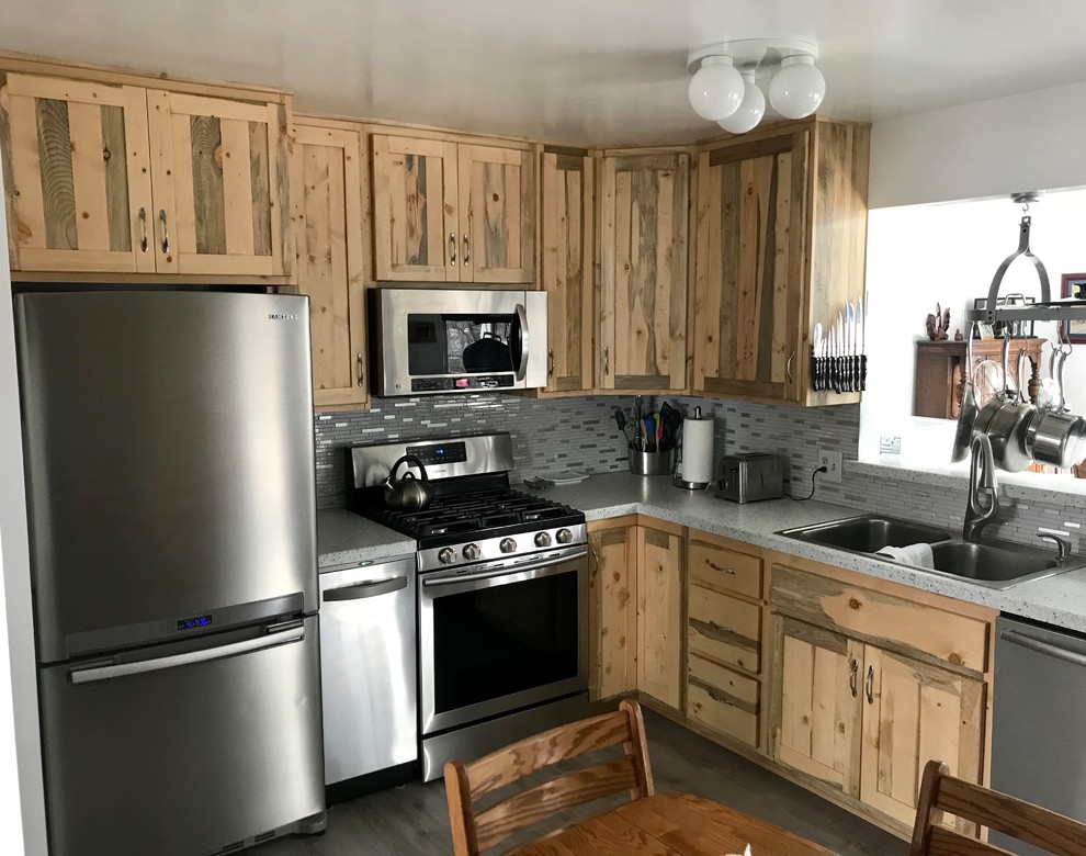 Inspiration for a small rustic u-shaped gray floor eat-in kitchen remodel in Denver with a double-bowl sink, shaker cabinets, medium tone wood cabinets, gray backsplash, glass tile backsplash, stainless steel appliances, no island and green countertops