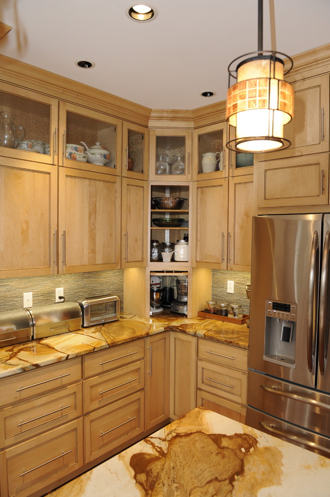 Inspiration for a mid-sized transitional u-shaped light wood floor eat-in kitchen remodel in Baltimore with a farmhouse sink, beaded inset cabinets, light wood cabinets, onyx countertops, stainless steel appliances and an island