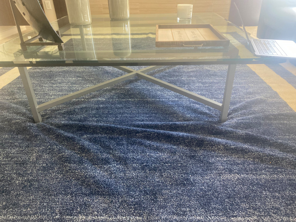 My rug ripples under a heavy coffee table