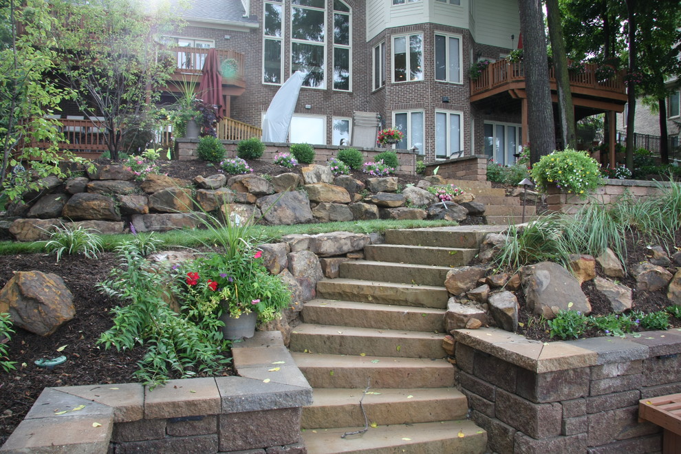 Design ideas for an expansive traditional backyard patio in Indianapolis with concrete pavers.