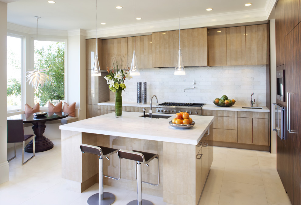 Design ideas for a modern galley eat-in kitchen in San Francisco with an undermount sink, flat-panel cabinets, light wood cabinets and white splashback.