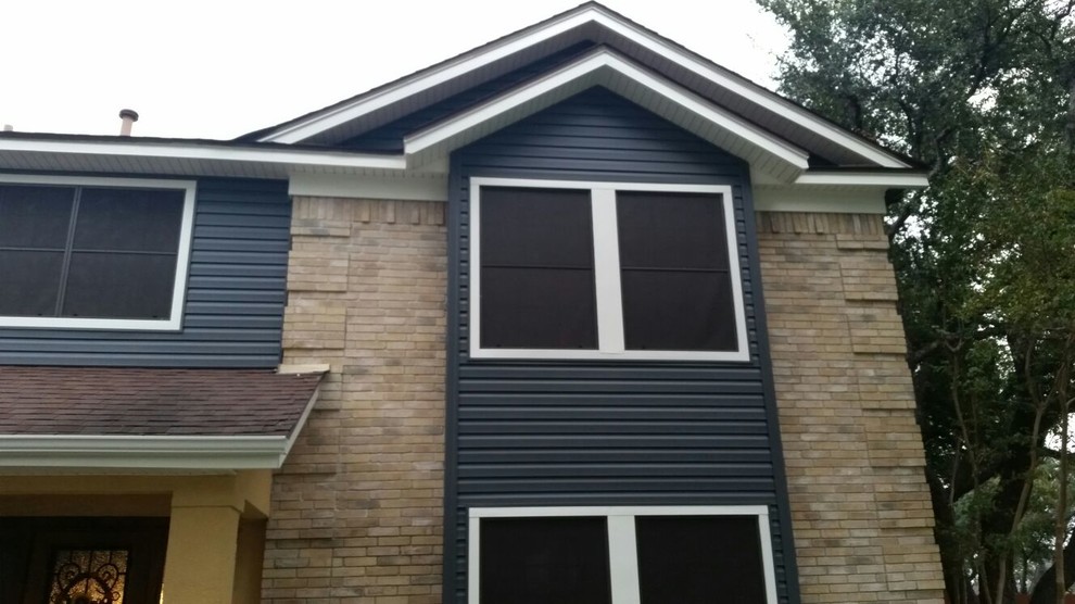Example of a mid-sized minimalist exterior home design in Austin