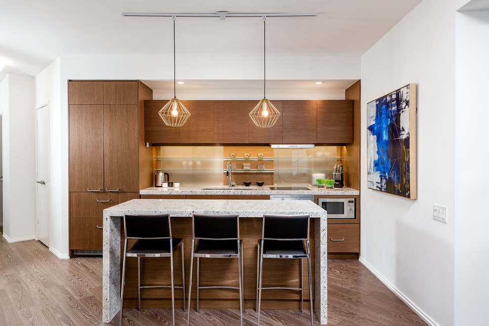 Photo of a contemporary galley kitchen in Toronto with flat-panel cabinets, dark wood cabinets, panelled appliances, dark hardwood floors and with island.