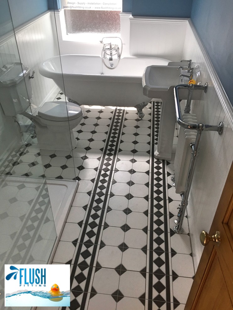 Design ideas for a traditional kids bathroom in West Midlands with a freestanding tub, an open shower, a two-piece toilet, white tile, ceramic tile, blue walls and a pedestal sink.