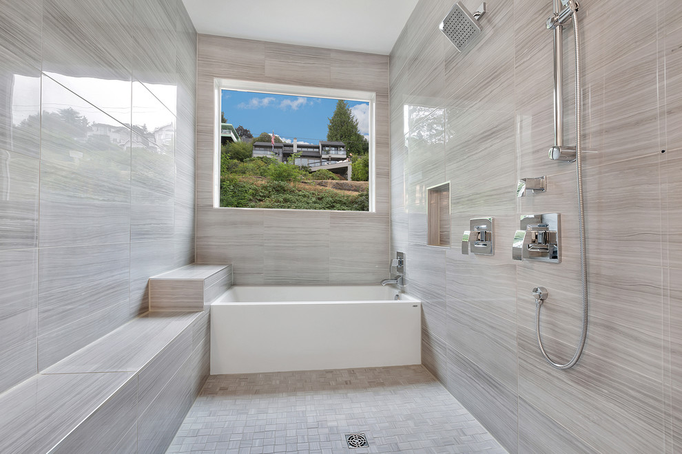 Inspiration for a mid-sized modern master bathroom in Seattle with a vessel sink, flat-panel cabinets, white cabinets, engineered quartz benchtops, an alcove tub, a shower/bathtub combo, gray tile, porcelain tile, white walls and porcelain floors.