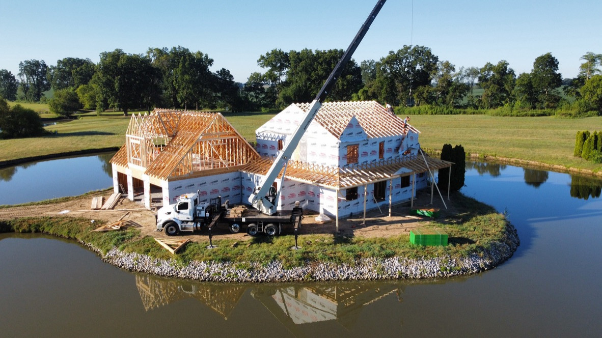 Beautiful beginnings to this modern farmhouse home surrounded by water.