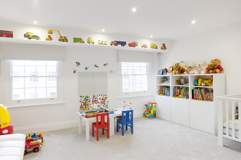 Photo of a large traditional gender-neutral kids' room in London with white walls and carpet.