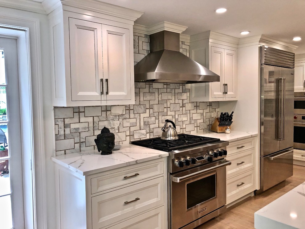 Example of a large transitional eat-in kitchen design in New York with beaded inset cabinets, gray cabinets, quartz countertops and an island