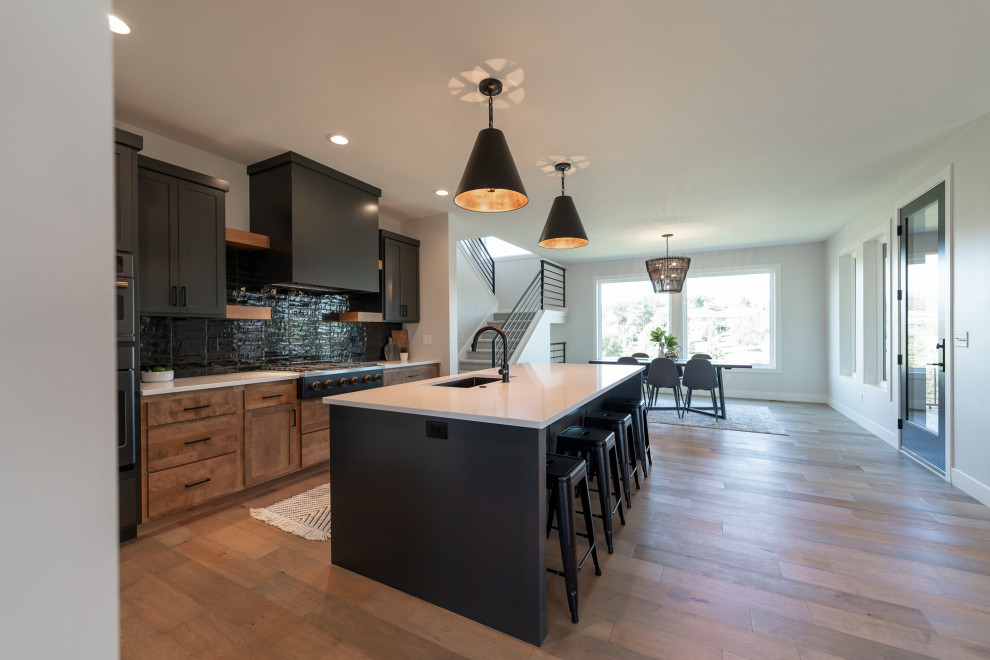 Inspiration for a rustic kitchen remodel with shaker cabinets and an island