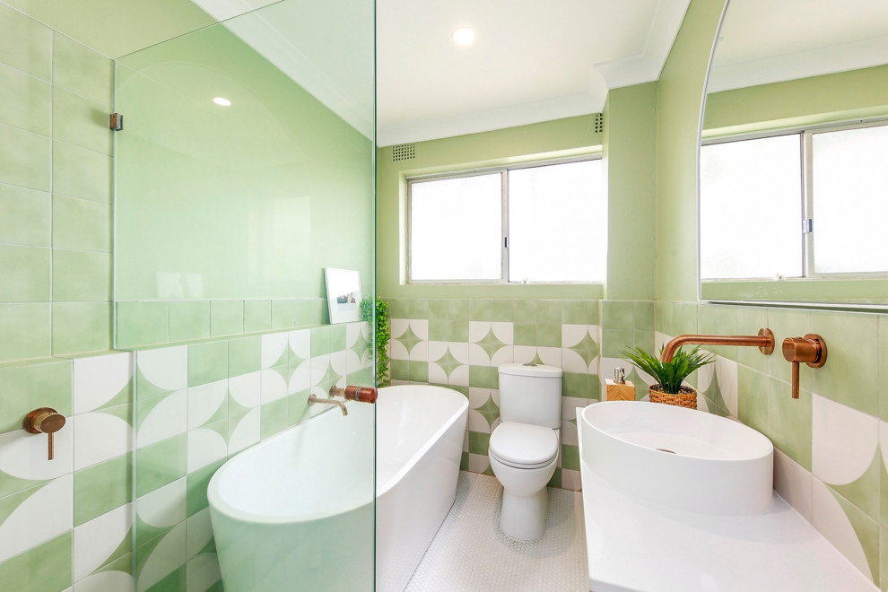 Contemporary bathroom in Sydney with a freestanding tub, green tile, green walls, mosaic tile floors, a vessel sink, white floor, white benchtops and a single vanity.