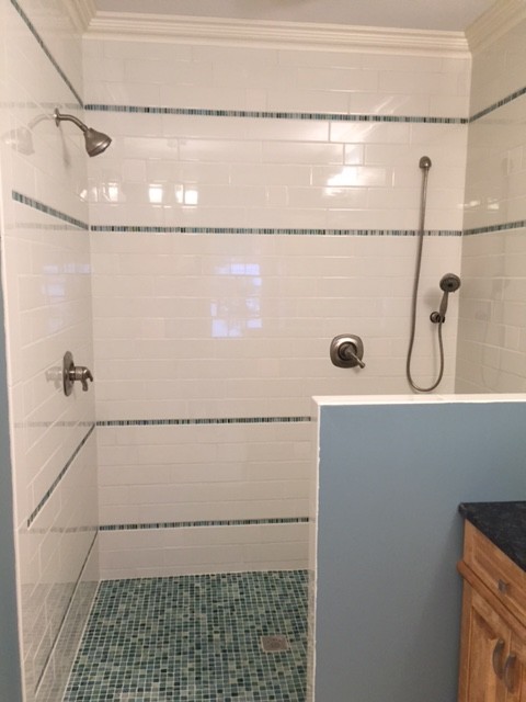 Design ideas for a contemporary master bathroom in Other with raised-panel cabinets, medium wood cabinets, an open shower, white tile, subway tile, blue walls, mosaic tile floors and engineered quartz benchtops.