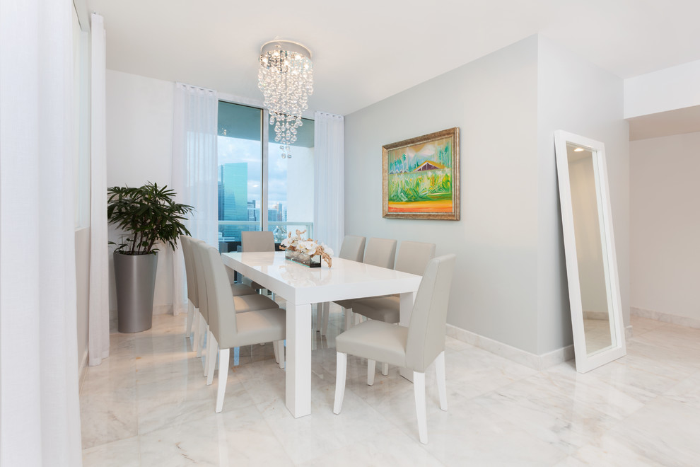 Mid-sized contemporary dining room in Miami with marble floors and no fireplace.