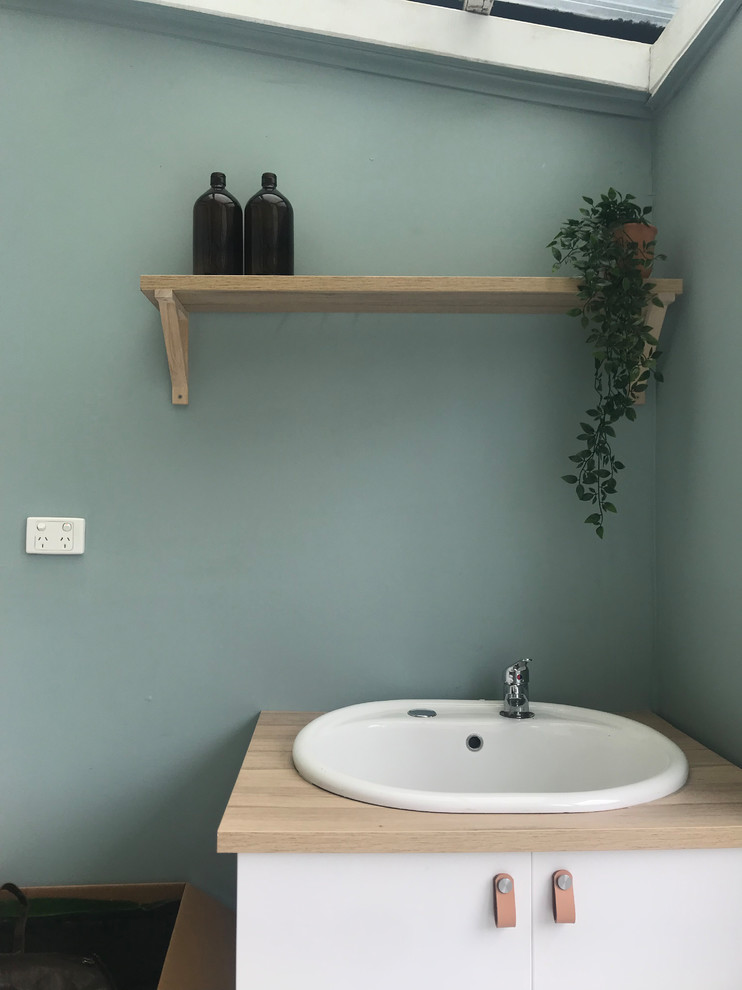 Design ideas for a small contemporary laundry room in Melbourne.