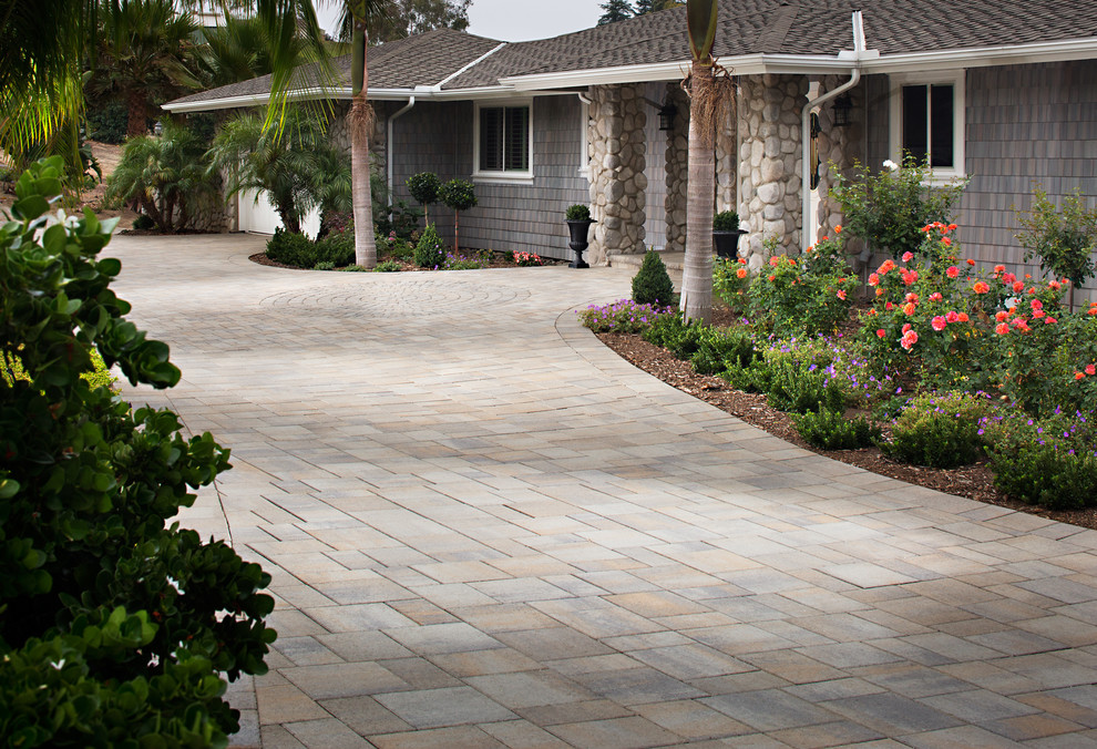 Large traditional front yard partial sun driveway in San Diego with concrete pavers.