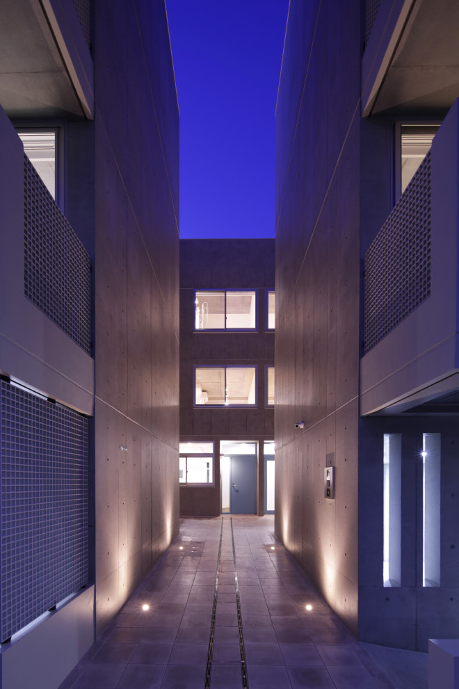 Photo of a large modern apartment exterior in Tokyo with four or more storeys.