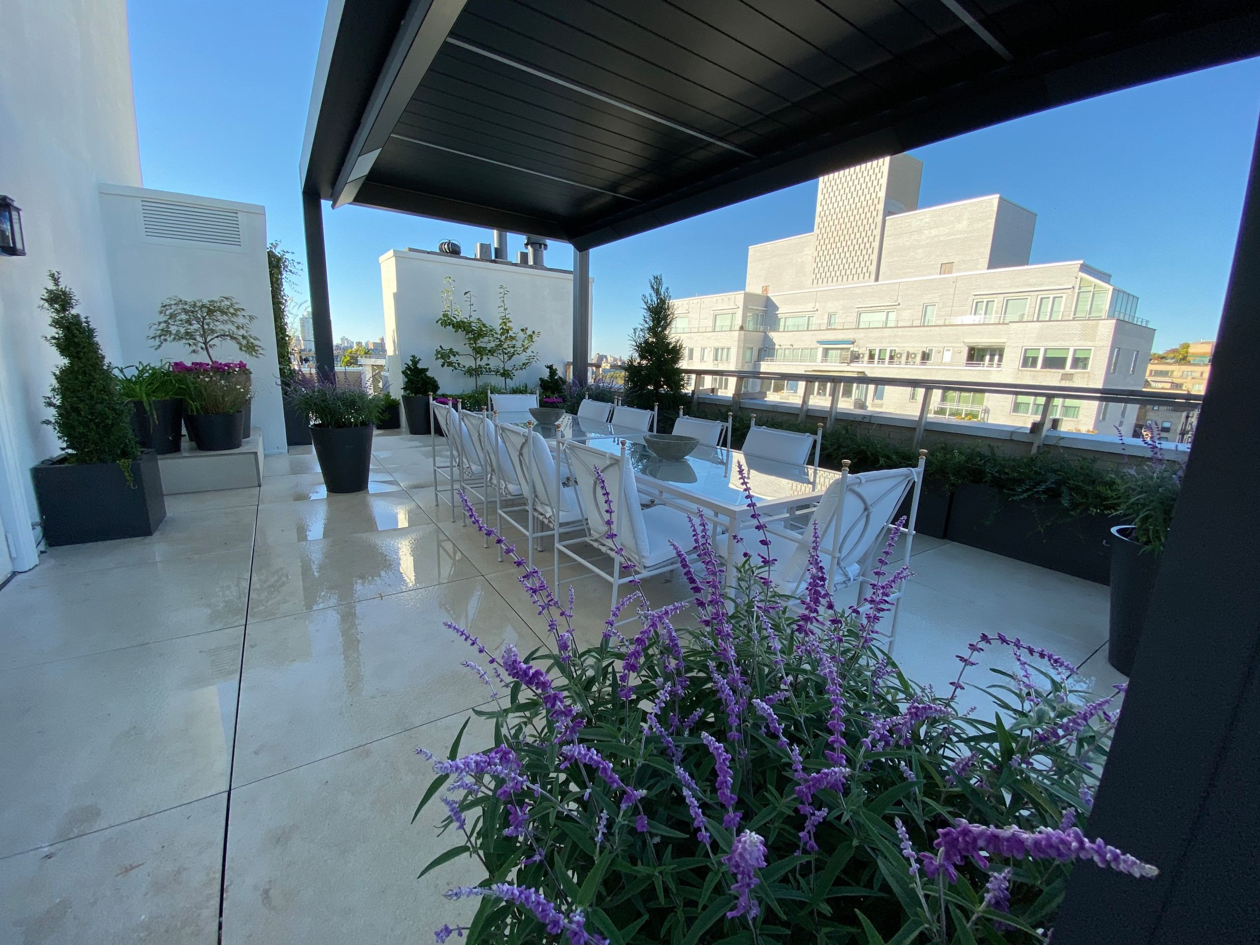 Prewar classic penthouse terrace, with a modern design intended to refresh the outdoor living space and make it more functional for the present day while providing an attractive aesthetic.