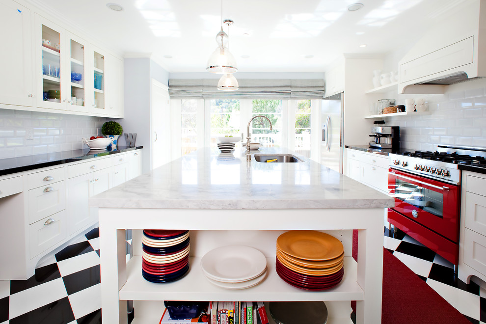 Photo of a transitional separate kitchen in San Francisco with open cabinets, a single-bowl sink, white cabinets, white splashback, subway tile splashback and coloured appliances.