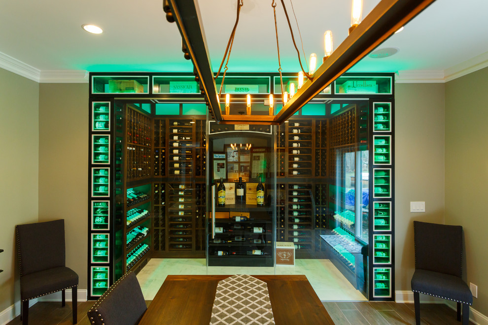 This is an example of a mid-sized contemporary wine cellar in New York with marble floors and display racks.