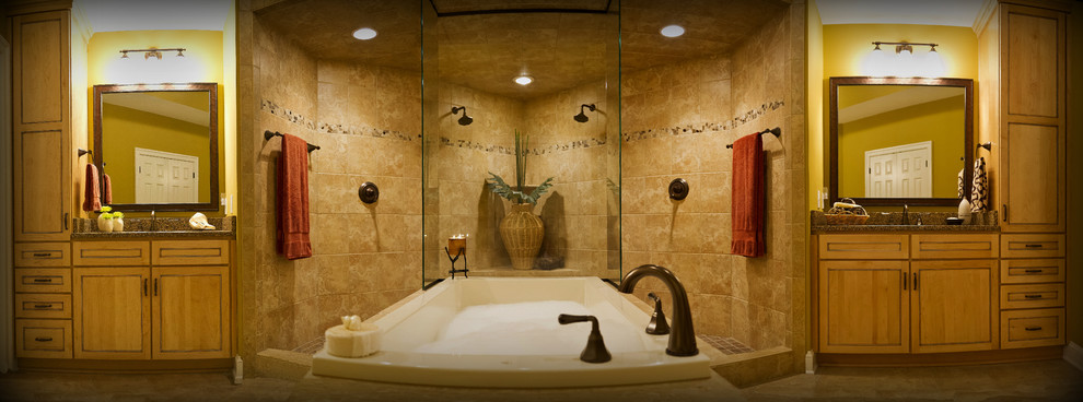 Design ideas for a large traditional master bathroom in Richmond with recessed-panel cabinets, light wood cabinets, a drop-in tub, a double shower, beige tile, stone tile, beige walls, marble floors, granite benchtops, beige floor and an open shower.