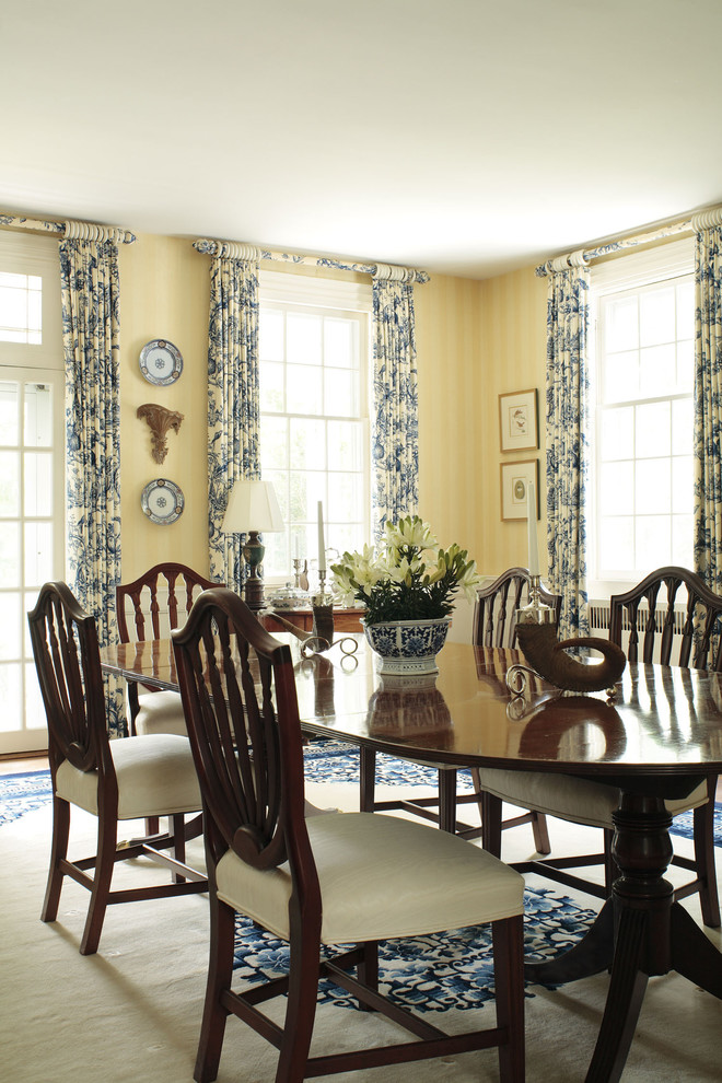 Design ideas for a traditional dining room in Other with yellow walls.